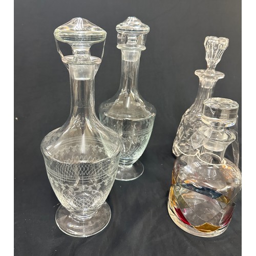 46 - Selection of glass decanters with stoppers, to include a pairs of etched