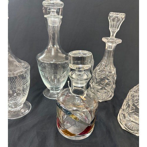 46 - Selection of glass decanters with stoppers, to include a pairs of etched