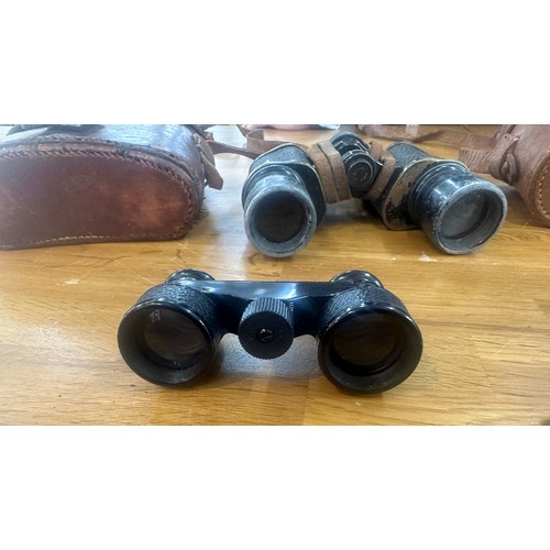 36 - Three pairs of vintage binoculars two possibly WW1 and one other