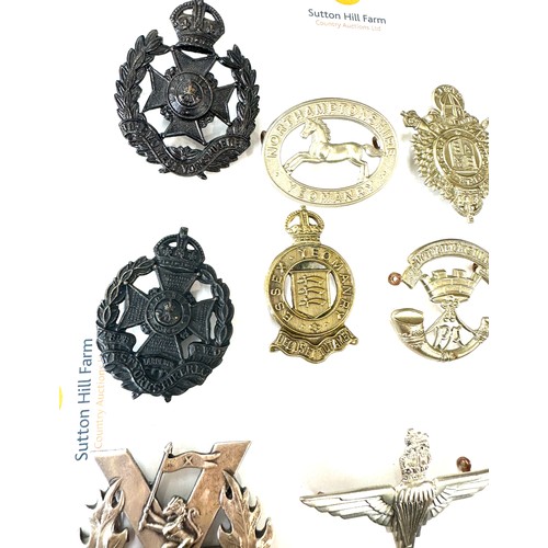 474 - Selection of vintage military cap badges