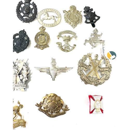 474 - Selection of vintage military cap badges