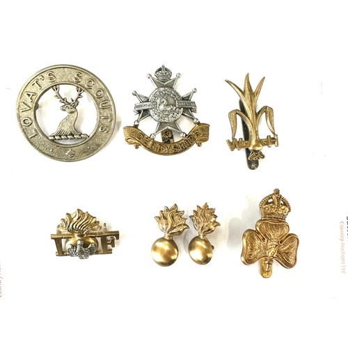 474 - Selection of vintage military cap badges