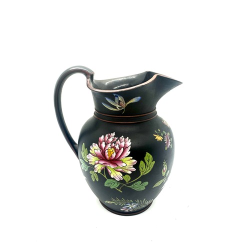 405 - 19th century Wedgwood black basalt pitcher with flower enamel decoration, has sustained small chips ... 