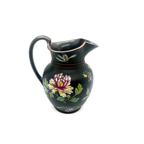 405 - 19th century Wedgwood black basalt pitcher with flower enamel decoration, has sustained small chips ... 