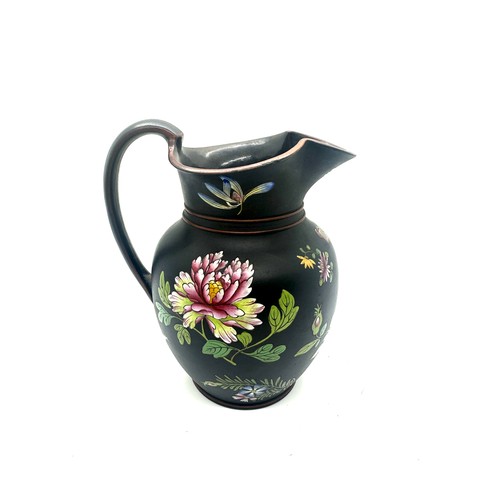 405 - 19th century Wedgwood black basalt pitcher with flower enamel decoration, has sustained small chips ... 