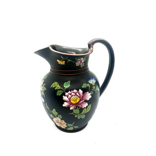 405 - 19th century Wedgwood black basalt pitcher with flower enamel decoration, has sustained small chips ... 