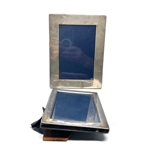 59 - 2 silver picture frames largest measures approx 20cm by 15cm