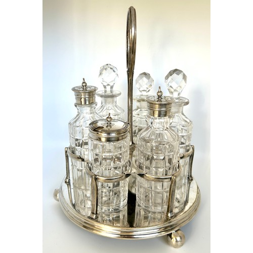 1 - Silver plated and pressed glass cruet set with stand, one bottle does have a crack