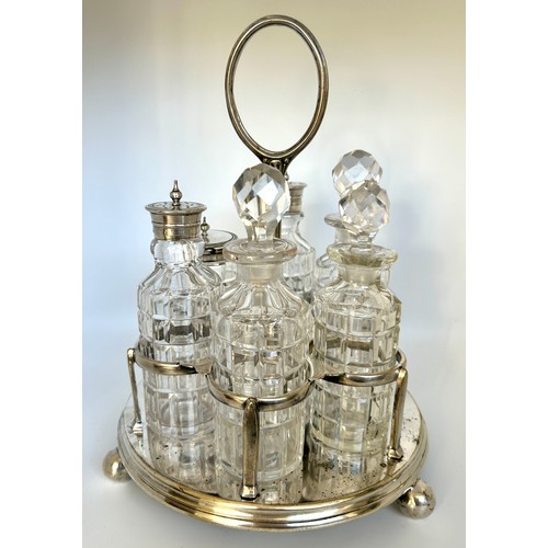 1 - Silver plated and pressed glass cruet set with stand, one bottle does have a crack