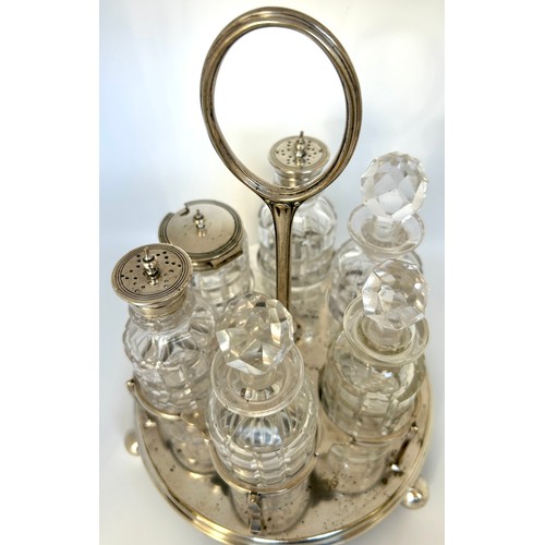 1 - Silver plated and pressed glass cruet set with stand, one bottle does have a crack