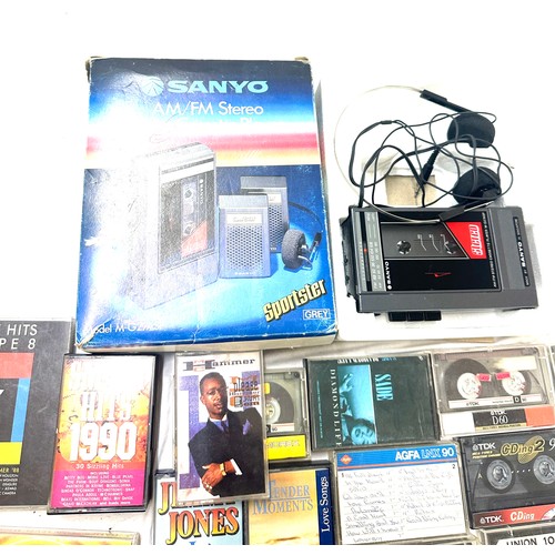 165 - Boxed Sanyo vintage walkman, model M-G27ASP together with a selection of cassettes, untested