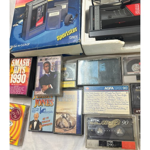 165 - Boxed Sanyo vintage walkman, model M-G27ASP together with a selection of cassettes, untested