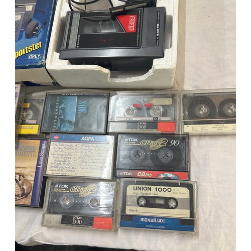 165 - Boxed Sanyo vintage walkman, model M-G27ASP together with a selection of cassettes, untested