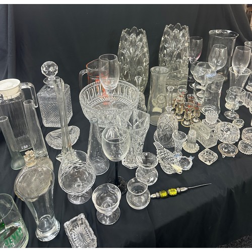 297 - Large selection of glassware to include a pair matching heavy glass vases, decanter, bowls, glasses ... 