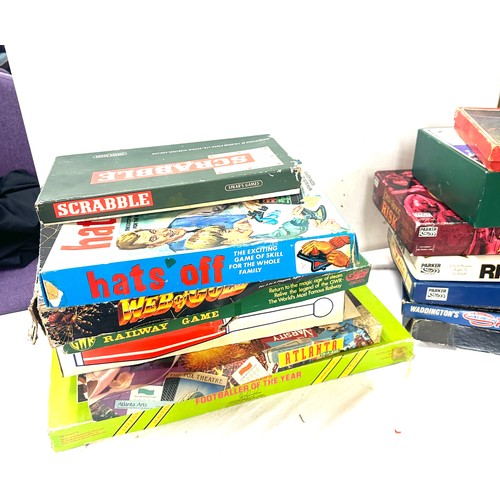 148 - Large selection of assorted games includes risk, scrabble, web of gold, spy ring etc