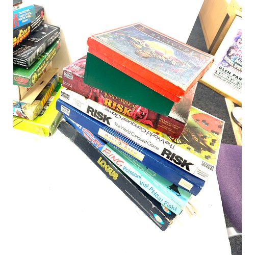 148 - Large selection of assorted games includes risk, scrabble, web of gold, spy ring etc