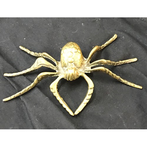 106 - 2 Brass spider ornaments