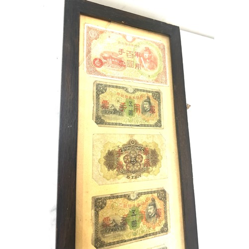 269 - Framed Chinese and Japanese vintage bank notes measures approximately 31 inches tall