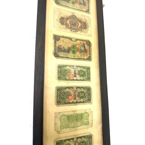 269 - Framed Chinese and Japanese vintage bank notes measures approximately 31 inches tall