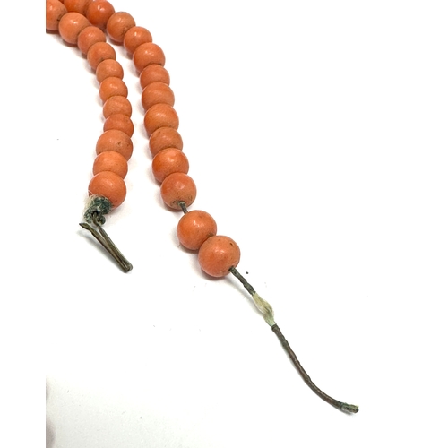 67 - Antique graduated coral necklace largest bead measures approx 14.5mm dia weight 24g missing clasp