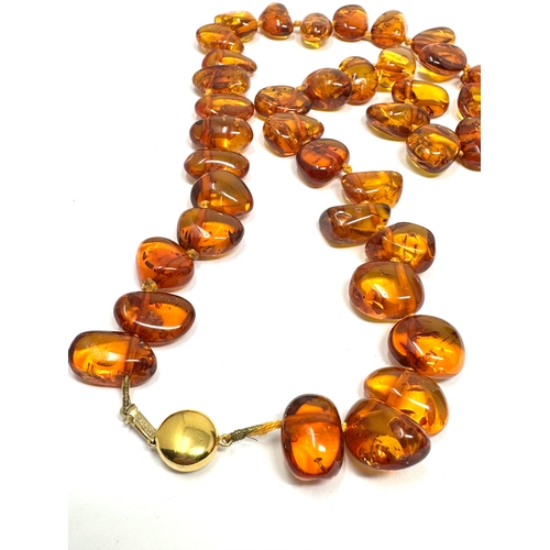 72 - Vintage 9ct gold clasp amber necklace measures approx 52cm long weight 41g