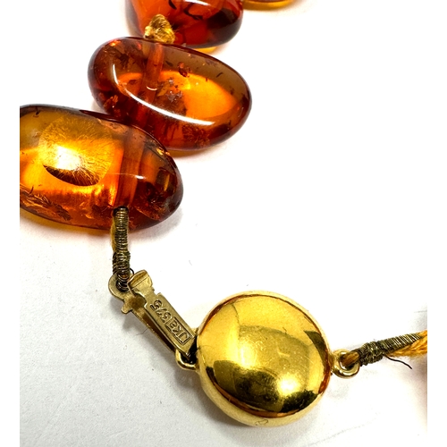 72 - Vintage 9ct gold clasp amber necklace measures approx 52cm long weight 41g