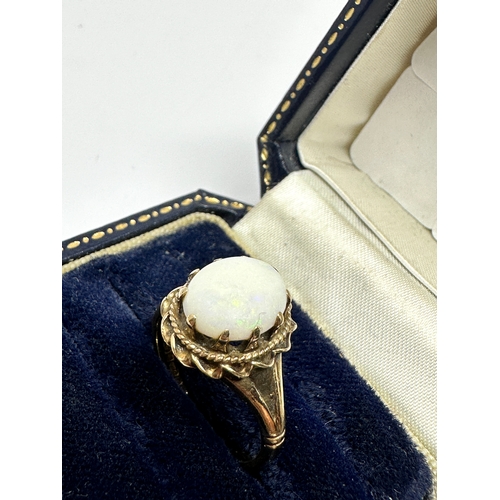 75 - 9ct gold opal ring weight 3.1g