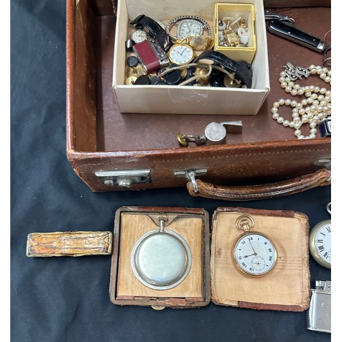 580 - Leather travelling case containing pocket watches, whistle, lighter, watches, travelling clock etc