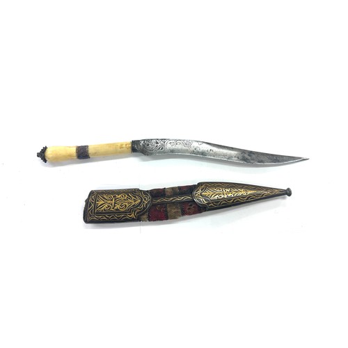 440 - Unusual Persian dagger. Chisel decoration to blade. Scabbard fittings inlaid with gold. Approx lengt... 