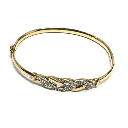 220 - 9ct gold diamond bangle (6g)