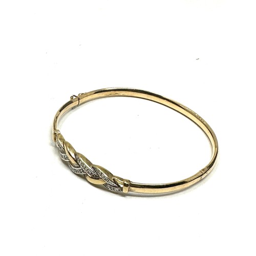 220 - 9ct gold diamond bangle (6g)