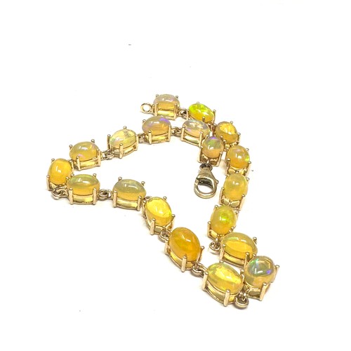 187 - 9ct gold cabochon cut opal bracelet (7.2g)