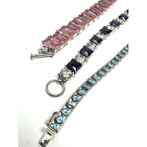 302 - Three chunky silver gemstone set tennis bracelets (128g)