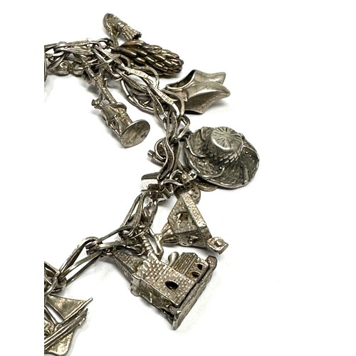 300 - A Vintage Silver Charm Bracelet With Assorted Novelty Charms (62g)