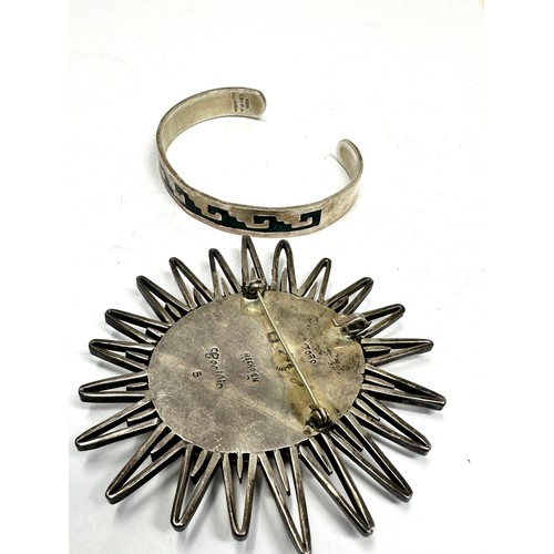 306 - Silver Mexico bangle and brooch including Cecilia (70g)