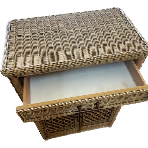 347 - 1 drawer 2 door wicker cabinet measures approximately 34 inches tall 24 inches wide 14 inches depth