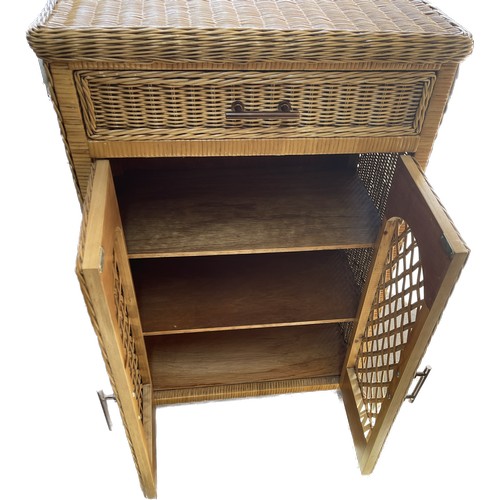 347 - 1 drawer 2 door wicker cabinet measures approximately 34 inches tall 24 inches wide 14 inches depth