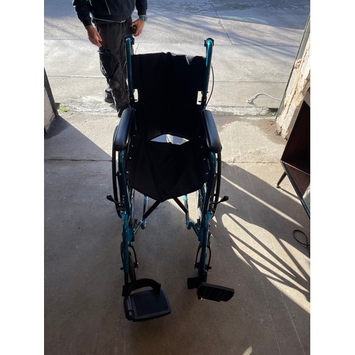 329 - Care co folding wheel chair