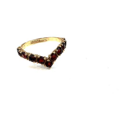 537 - Ladies 9ct gold garnet set wish bone ring, 2 grams ring size p