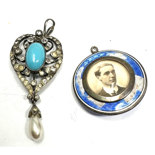 335 - Two Edwardian silver pendants including a paste lavalier (18g)