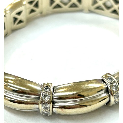 526 - Hallmarked 18ct gold and diamond ladies bracelet, featuring 24 small diamonds, total weight 55.6g