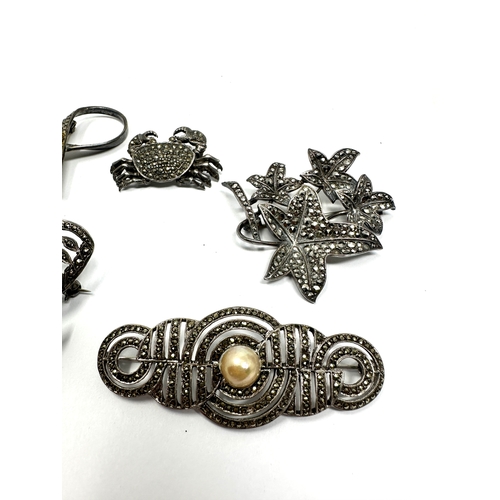 341 - Five silver marcasite brooches (53g)