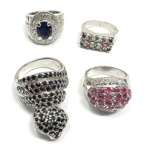 338 - Four silver stone set cocktail rings including a sapphire cobra (37g)