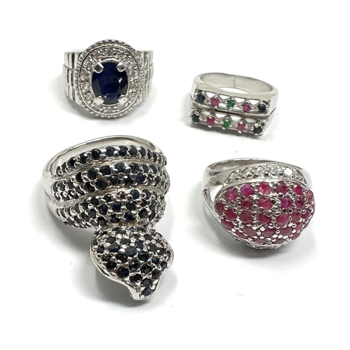 338 - Four silver stone set cocktail rings including a sapphire cobra (37g)