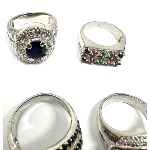 338 - Four silver stone set cocktail rings including a sapphire cobra (37g)