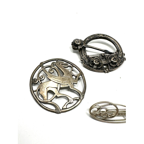 321 - Four Celtic silver brooches including a Shetland Silver example (31g)