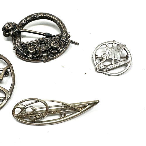 321 - Four Celtic silver brooches including a Shetland Silver example (31g)