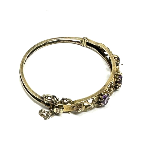 313 - A decorative silver bangle set with amethyst (13g)