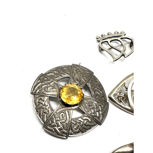 343 - Four silver Celtic design brooches including one by Ola Gorie (36g)