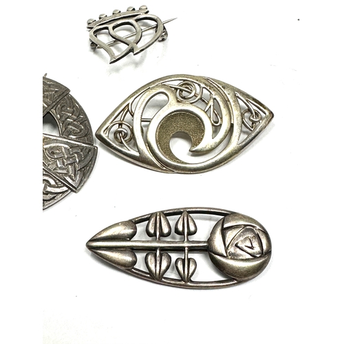 343 - Four silver Celtic design brooches including one by Ola Gorie (36g)